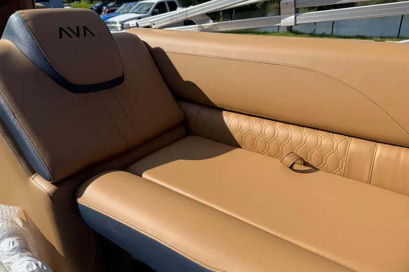 Slide: The Image of Luxurious tan seating in 2026 Avalon 2385 25 LSZ QLS boat, featuring elegant stitching. - 16