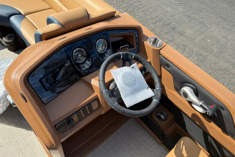 Slide: The Image of Interior view of 2026 Avalon 2385 25 LSZ QLS boat dashboard and steering wheel. - 14