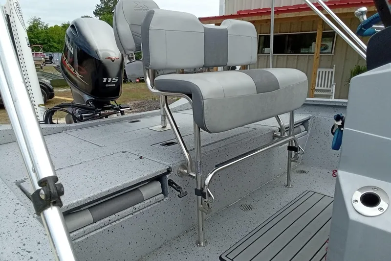 Slide: The Image of 2021 Xpress H20B Bay boat interior with Yamaha 115 engine and dual seating. - 15