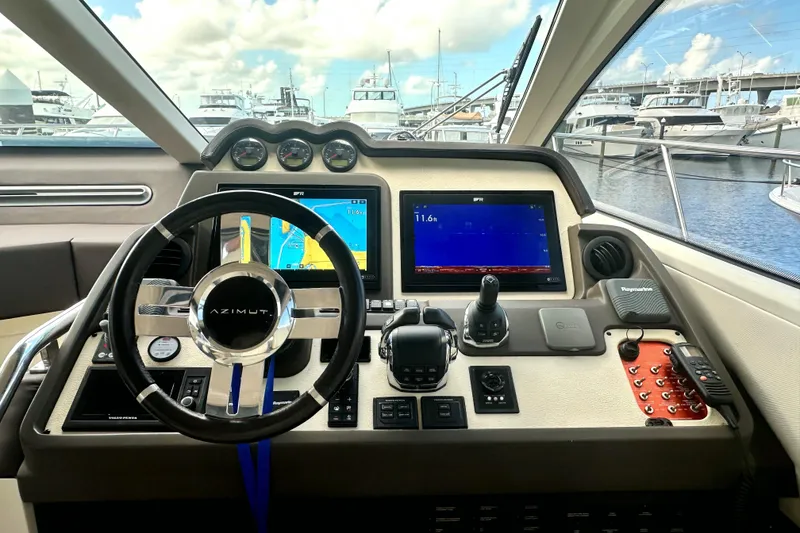 Slide: The Image of Cockpit of 2015 Azimut 55S yacht with navigation screens and steering wheel. - 15