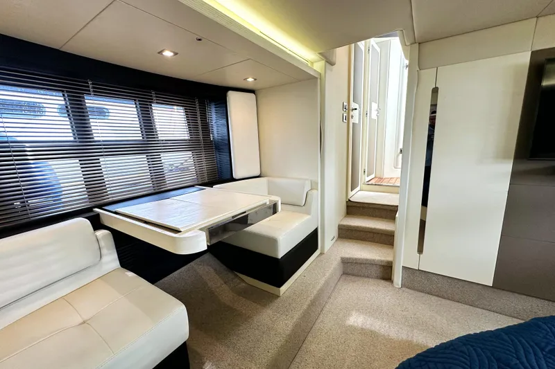 Slide: The Image of Luxurious interior of a 2015 Azimut 55S yacht with modern seating and dining area. - 27