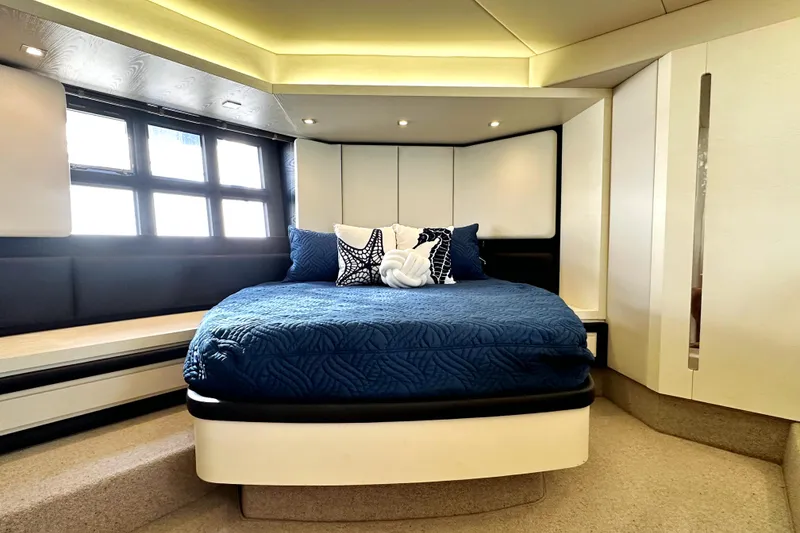 Slide: The Image of Luxurious bedroom interior of 2015 Azimut 55S yacht with modern design and blue bedding. - 25