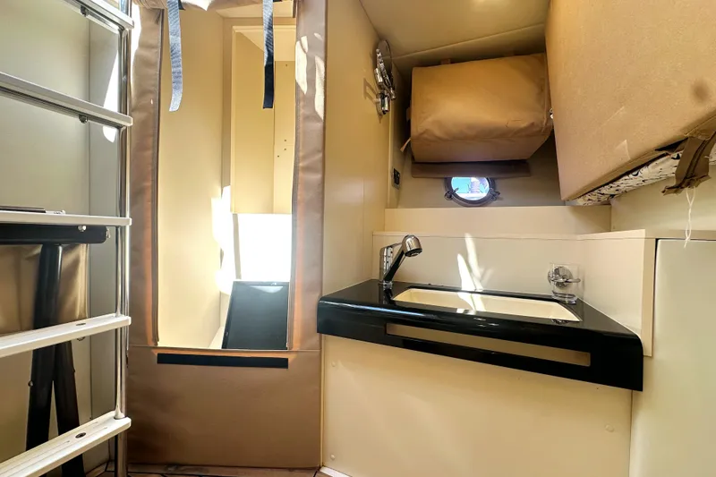 Slide: The Image of Interior of 2015 Azimut 55S yacht featuring compact sink and storage area. - 36