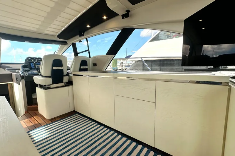 Slide: The Image of Luxurious interior of a 2015 Azimut 55S yacht with modern helm and seating. - 21