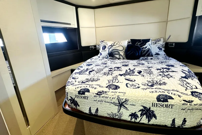Slide: The Image of Luxurious bedroom interior of 2015 Azimut 55S yacht with nautical-themed bedding. - 31