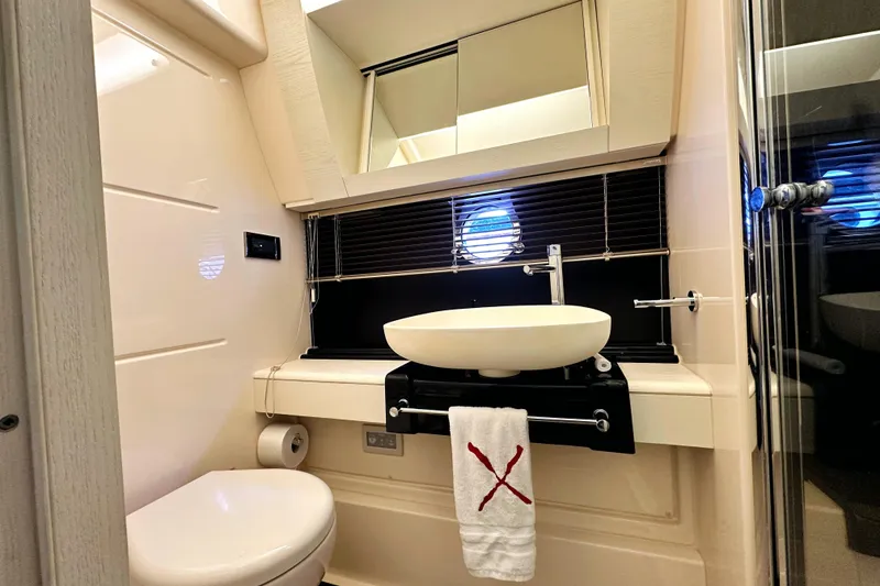 Slide: The Image of Luxurious bathroom interior of a 2015 Azimut 55S yacht, featuring modern fixtures. - 29