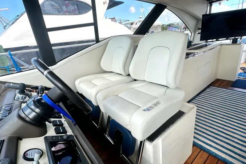 Slide: The Image of Interior of 2015 Azimut 55S yacht with white leather seats and control panel. - 17