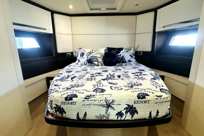 Slide: The Image of Luxurious bedroom interior of 2015 Azimut 55S yacht with nautical-themed bedding. - 30