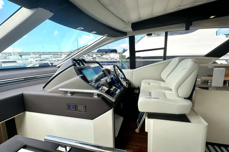 Slide: The Image of Interior cockpit of 2015 Azimut 55S yacht with modern navigation system and white seating. - 16