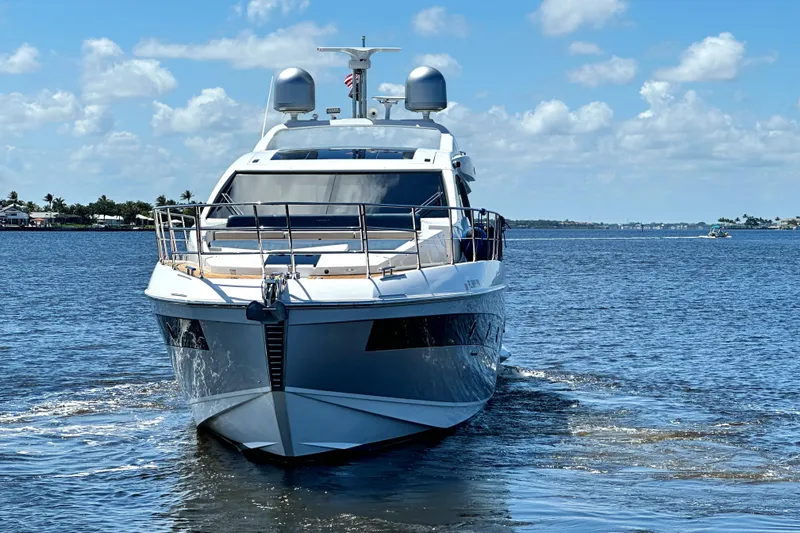 Slide: The Image of 2015 Azimut 55S yacht cruising on a sunny day with blue skies and calm waters. - 2