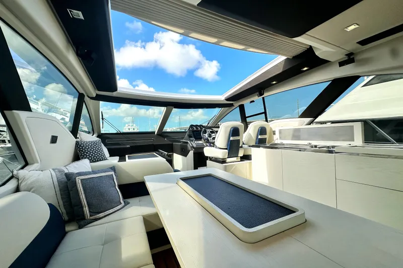 Slide: The Image of Luxurious interior of a 2015 Azimut 55S yacht with modern seating and panoramic windows. - 18