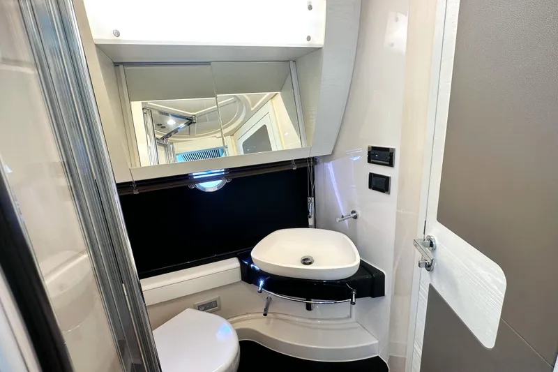 Slide: The Image of Luxurious bathroom interior of 2015 Azimut 55S yacht, featuring modern sink and mirror. - 33