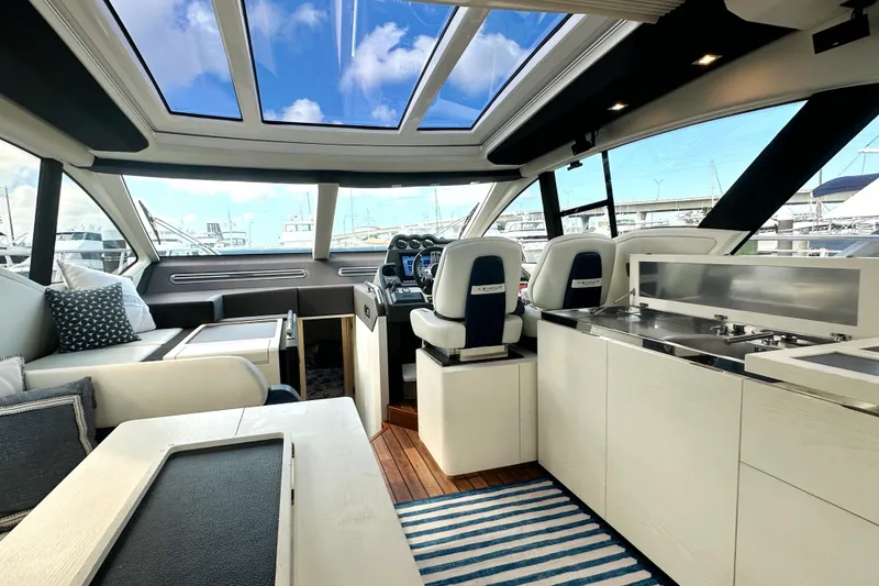 Slide: The Image of Luxurious interior of a 2015 Azimut 55S yacht with modern furnishings and panoramic windows. - 20