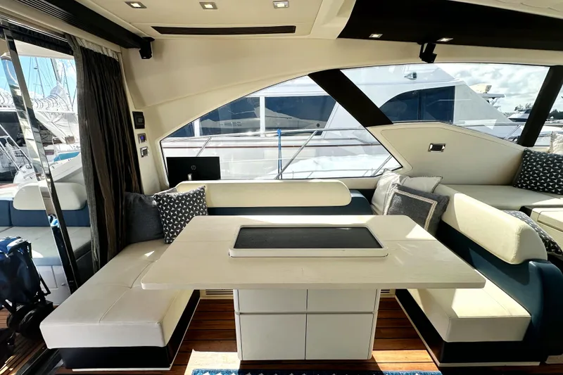 Slide: The Image of Luxurious interior of a 2015 Azimut 55S yacht with elegant seating and table. - 22