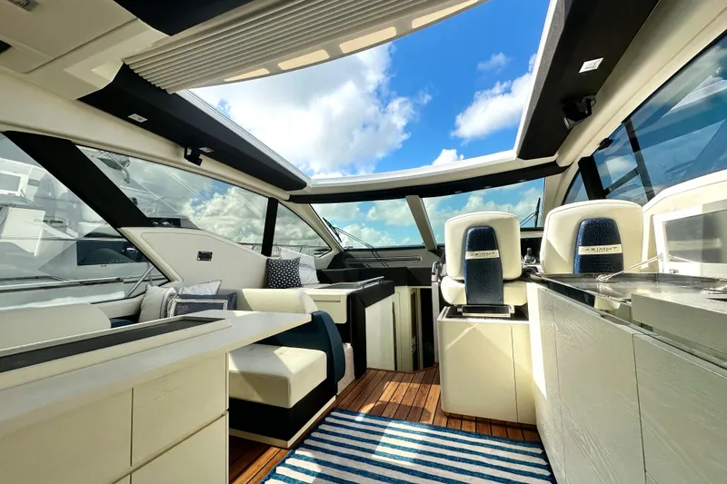 Slide: The Image of Luxurious interior of a 2015 Azimut 55S yacht with modern seating and panoramic windows. - 19