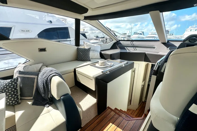 Slide: The Image of Luxurious interior of a 2015 Azimut 55S yacht with elegant seating and decor. - 23