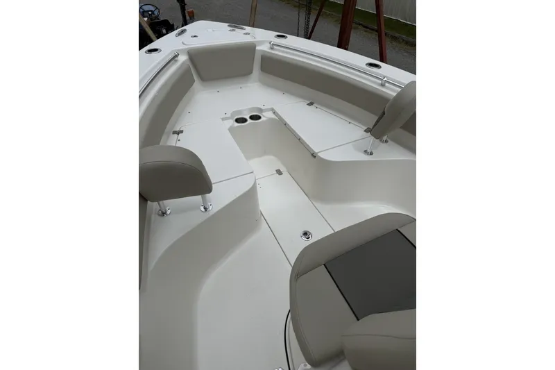 Slide: The Image of 2026 Key West 239 FS boat interior with seating and storage compartments. - 4