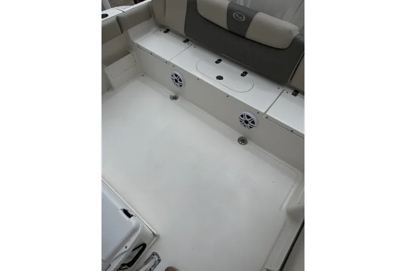 Slide: The Image of 2026 Key West 239 FS boat interior with seating and storage compartments. - 6