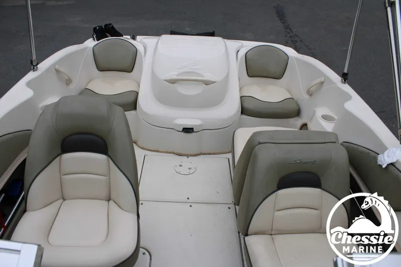 Slide: The Image of Interior of a 2005 Sea Ray 180SPBR boat with beige seating. - 12