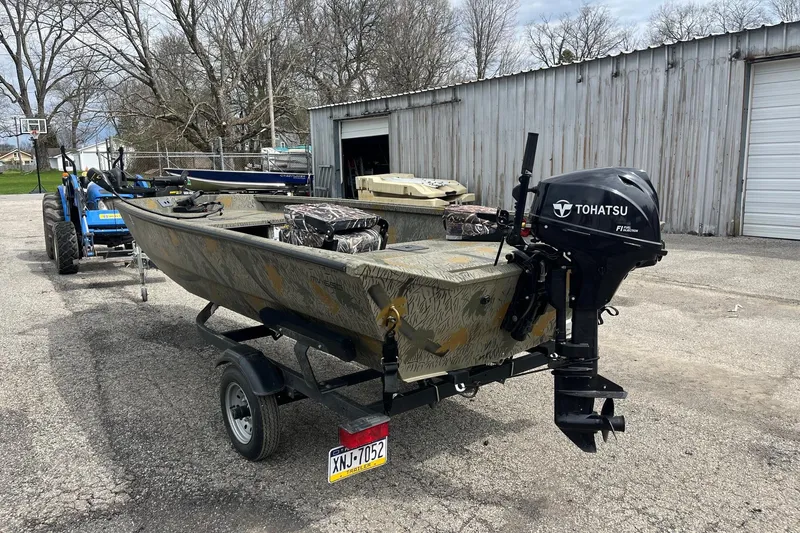 Slide: The Image of 2022 Alumacraft 1650 All Weld MV Tiller boat with Tohatsu motor on trailer. - 3