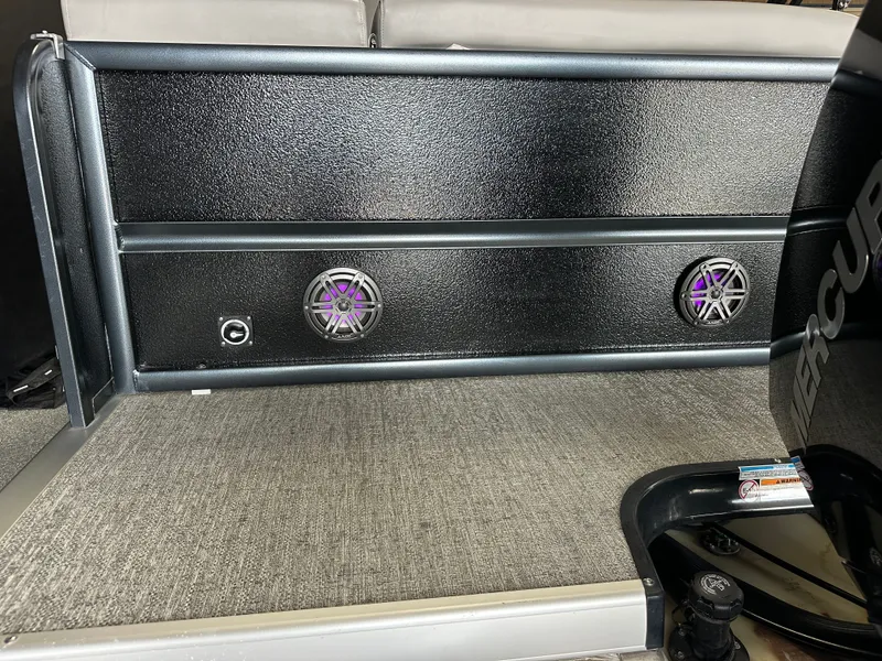 Slide: The Image of 2024 Premier 230 Sunsation TRITOON with speakers and carpeted flooring. - 18