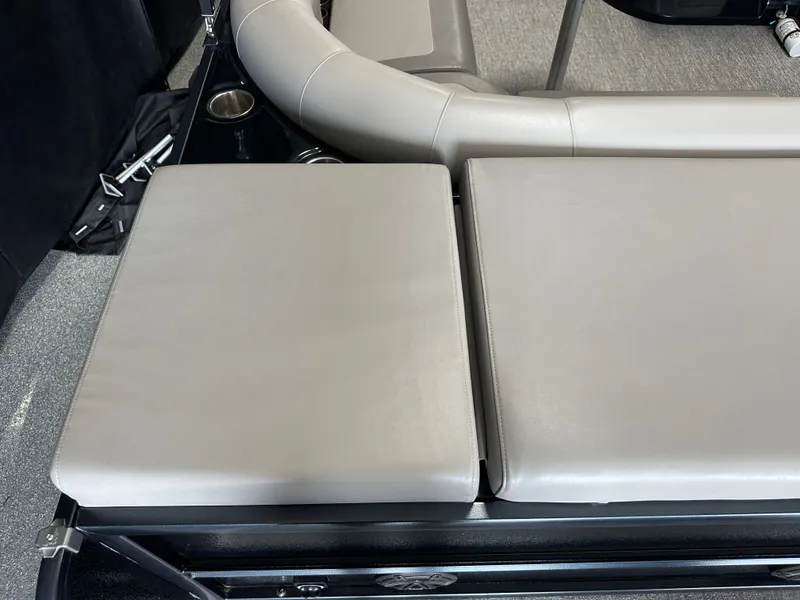 Slide: The Image of 2024 Premier 230 Sunsation TRITOON seating area with gray cushions. - 21