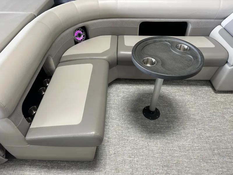 Slide: The Image of Interior of 2024 Premier 230 Sunsation TRITOON with table and seating area. - 26