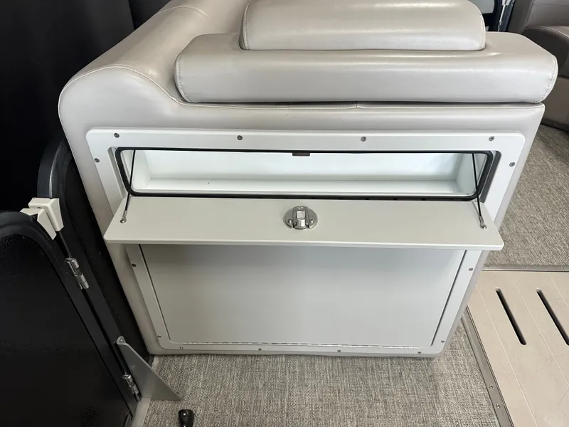 Slide: The Image of 2024 Premier 230 Sunsation TRITOON interior with storage compartment. - 40