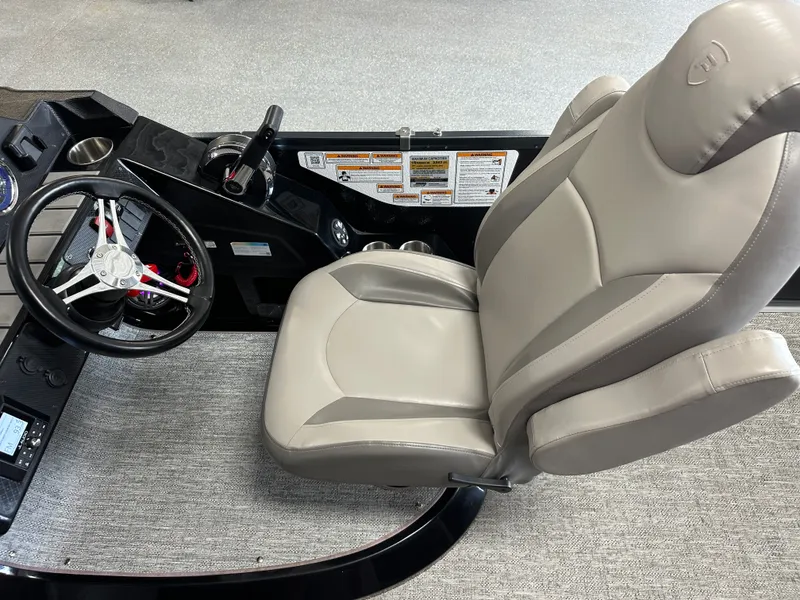 Slide: The Image of Interior of 2024 Premier 230 Sunsation TRITOON with steering wheel and seat. - 43