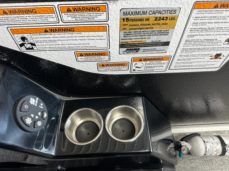Slide: The Image of Warning labels and capacity details on a 2024 Premier 230 Sunsation TRITOON. - 44