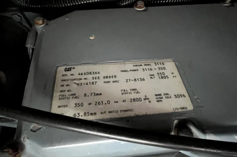 Slide: The Image of Engine specification label on a 1999 Tiara Yachts 3500 Open, displaying model and performance details. - 43