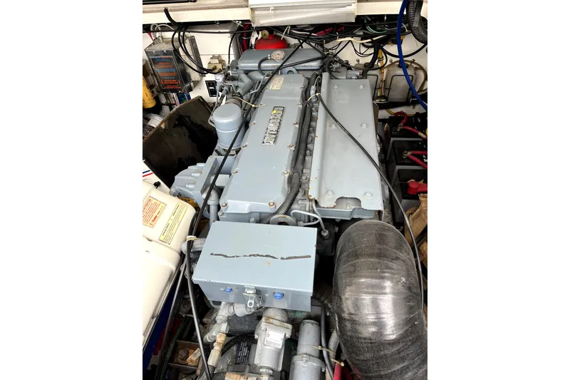 Slide: The Image of Engine compartment of a 1999 Tiara Yachts 3500 Open, showcasing detailed mechanical components. - 39