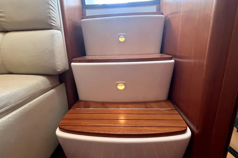 Slide: The Image of Wooden steps with lighting inside a 1999 Tiara Yachts 3500 Open. - 12