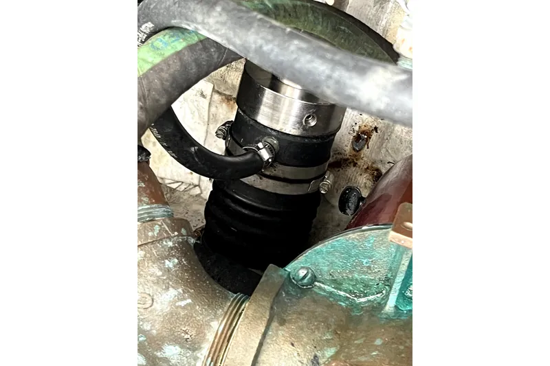 Slide: The Image of Engine compartment of a 1999 Tiara Yachts 3500 Open, showing hoses and clamps. - 42