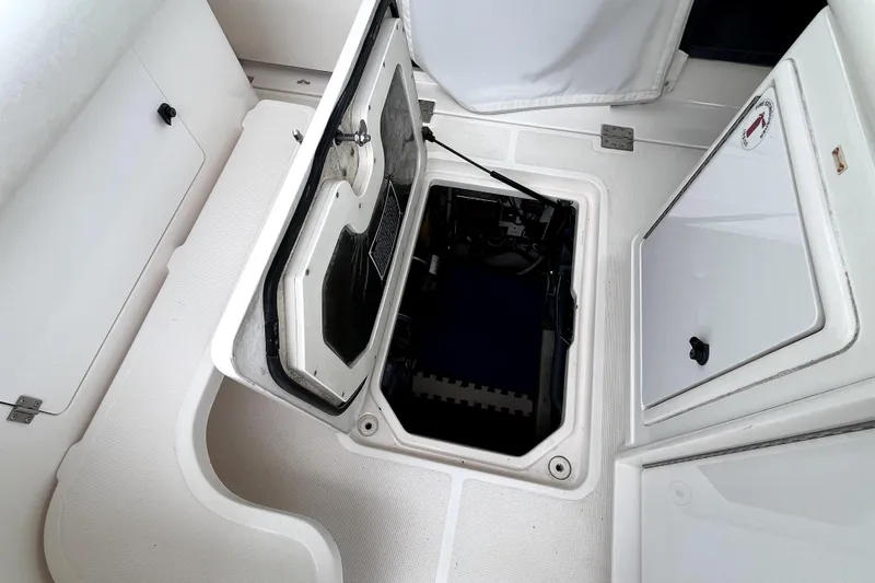 Slide: The Image of Engine compartment of a 1999 Tiara Yachts 3500 Open, showcasing storage and access features. - 36