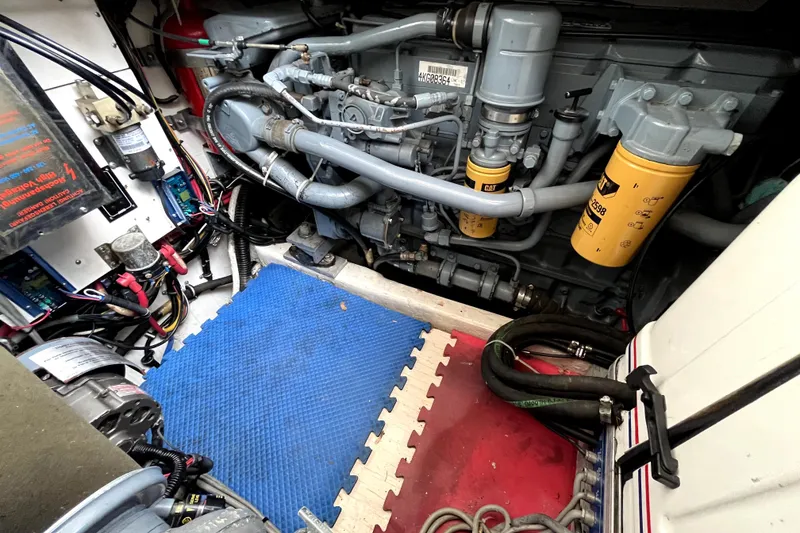 Slide: The Image of Engine room of a 1999 Tiara Yachts 3500 Open, showcasing mechanical components and wiring. - 37