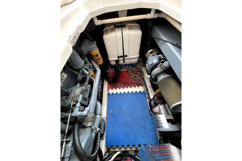 Slide: The Image of Engine room of a 1999 Tiara Yachts 3500 Open, showcasing mechanical components. - 38