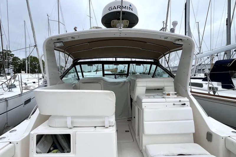 Slide: The Image of 1999 Tiara Yachts 3500 Open with Garmin equipment, docked at a marina. - 17