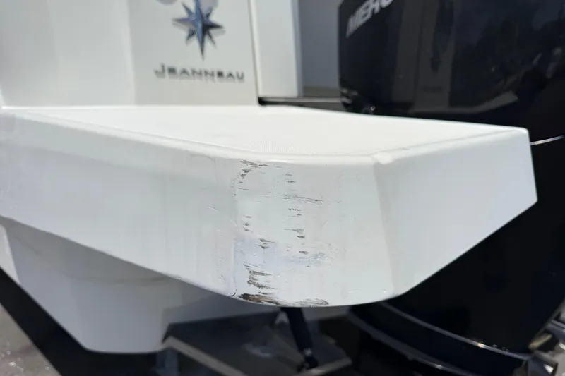 Slide: The Image of Close-up of 2021 Jeanneau NC 895 boat with visible scuff marks on the hull. - 10