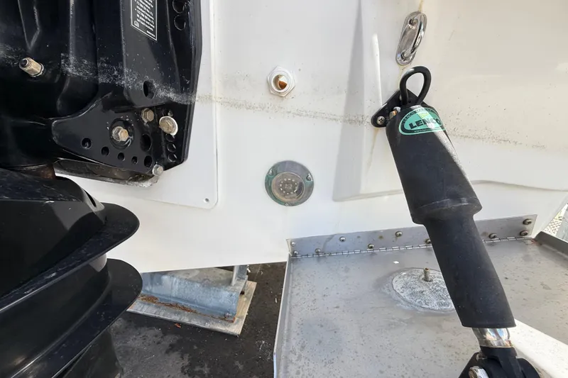 Slide: The Image of Close-up of Jeanneau NC 895 boat's engine and trim tab, 2021 model. - 12