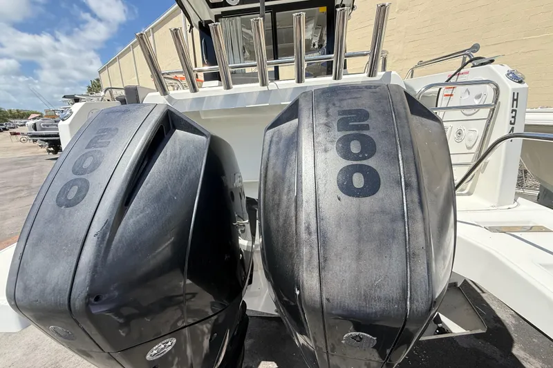 Slide: The Image of Twin 200 horsepower outboard engines on a 2021 Jeanneau NC 895 boat. - 14