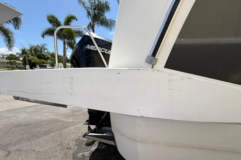 Slide: The Image of 2021 Jeanneau NC 895 boat with Mercury engine, parked near palm trees. - 15