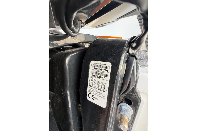 Slide: The Image of Close-up of a 2021 Jeanneau NC 895 engine label with serial number details. - 18
