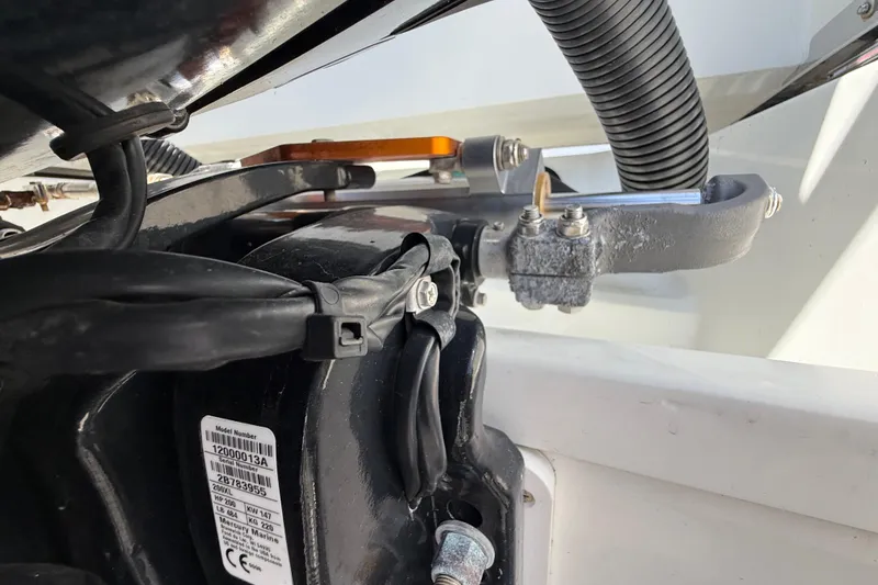 Slide: The Image of Close-up of Jeanneau NC 895 boat engine components, showcasing wiring and mechanical parts. - 19