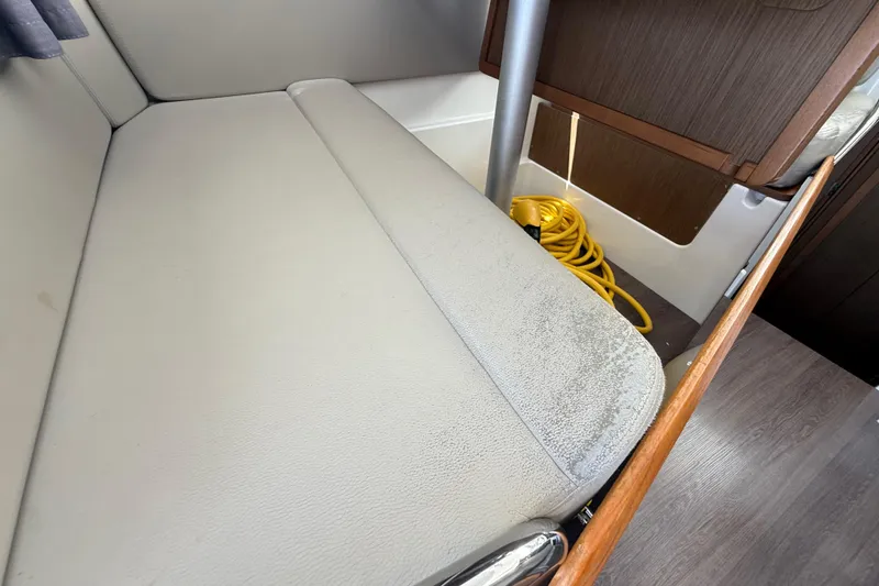 Slide: The Image of Interior of 2021 Jeanneau NC 895 boat with seating and storage area. - 24