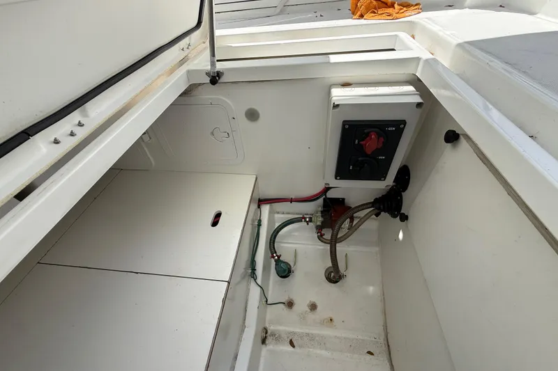 Slide: The Image of 2021 Jeanneau NC 895 boat storage compartment with electrical panel and wiring. - 29