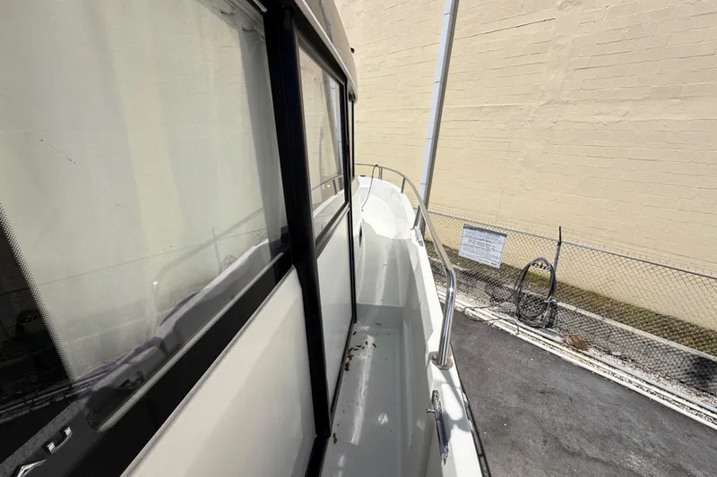 Slide: The Image of 2021 Jeanneau NC 895 boat side view with railing and windows. - 34