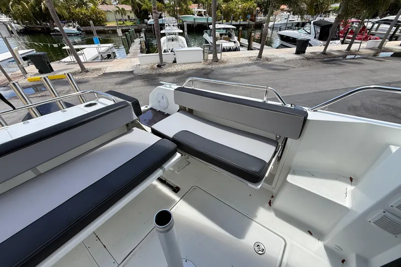 Slide: The Image of 2021 Jeanneau NC 895 boat interior with seating, docked at marina. - 37