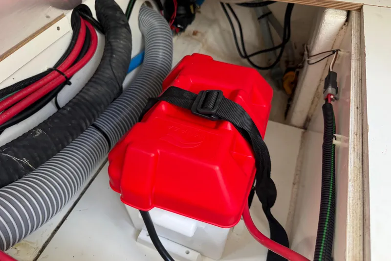 Slide: The Image of Red battery box in Jeanneau NC 895 boat, 2021 model, with secured wiring. - 39