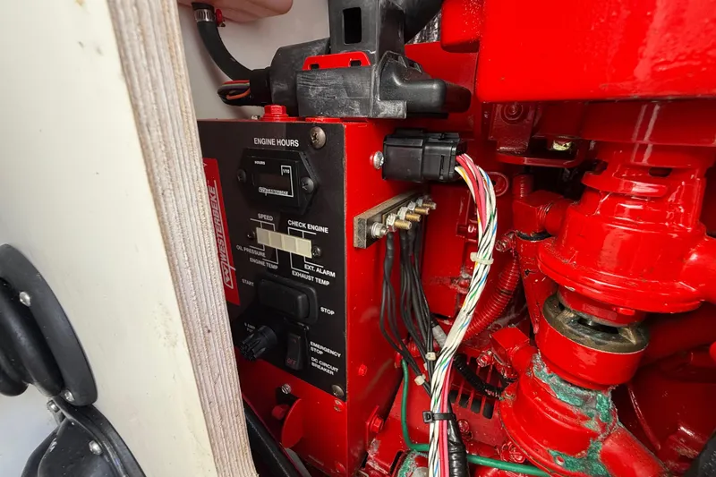 Slide: The Image of Engine control panel of a 2021 Jeanneau NC 895 boat, featuring wiring and gauges. - 43